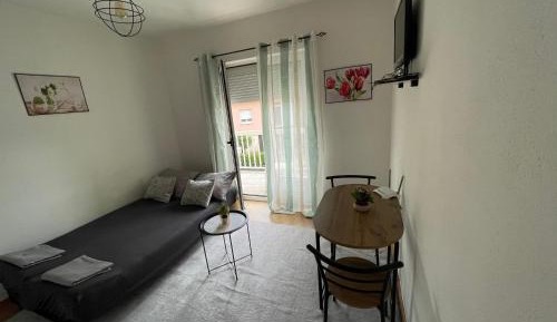 One-Bedroom Apartment with Balcony and City View