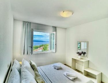 One-Bedroom Apartment with Balcony and Sea View