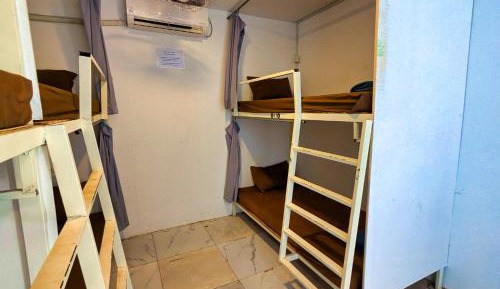 Single Bed in Dormitory Room