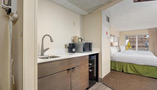 Standard Queen Room with Balcony and Side City view