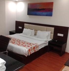 Deluxe Room with  Complimentary /Courtsey pick up and drop to darshan points i.e. Either Banganga or helipad