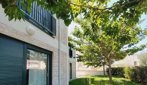 Two-Bedroom Apartment with Balcony and Garden View