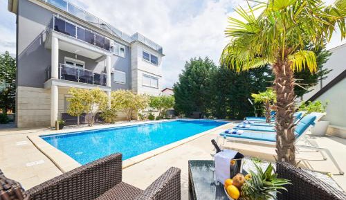 Three-Bedroom Apartment with Balcony and Pool Access