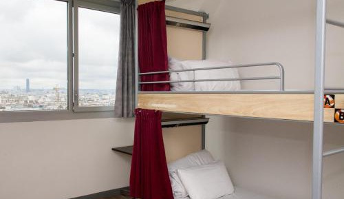 Bed in 8-Bed Dormitory Room with Shared Bathroom