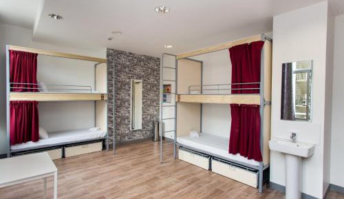 Bed in 10-Bed Dormitory Room with Shared Bathroom