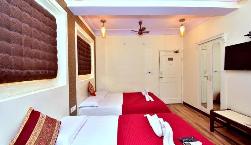 Family Room with fan (4 Adults) - 10% off on SURA Cocktails & Cuisines, Enjoy Live Music, Welcome Drink on Arrival and Free Pickup from Railway Station