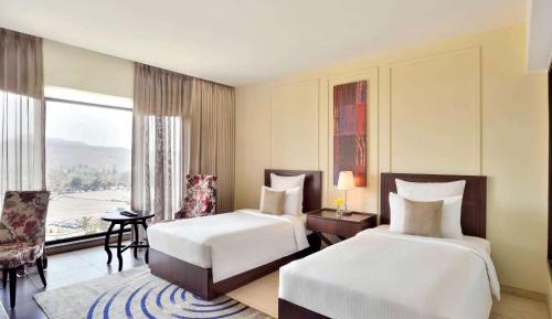 Deluxe Twin Room with Balcony with Complimentary one free ticket for Trampoline Park at Imagicaa per room per stay and 20% discount on Food and Beverage