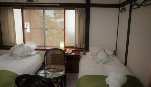 Quadruple Room with Shared Bathroom