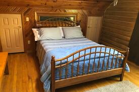 Orange City Cabin | Unique "Log Cabin on a Lake" in the Woods