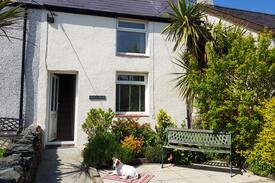 Newborough Cabin | Tan Y Fron Cottage Newborough beach with cosy fire