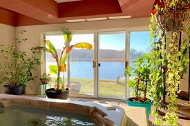 Plattsmouth House | The Cove: Lakeside Beach, Hot Tub, and Indoor Pool