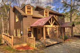 Ellijay Cabin | Clear Creek Cabin is a peaceful and quite 4 bed 2 bath cabin that sits on a mountain stream with pool and ping pong tables.