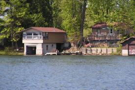 Irons House | COZY WATERFRONT BOATHOUSE BIG BASS LAKE IRONS MI