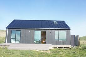 Curio Bay House | The Little Black Barn overlooking Curio Bay