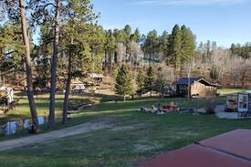 Rapid City House | The Love Shack next to stream in the Black Hills