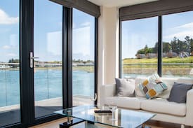 Belfast Boat Rental | Luxury Boathouse floating on Lake