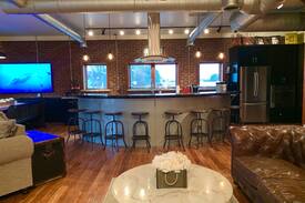 Fayetteville House | The Aviator's Lounge, loft living in the NRG