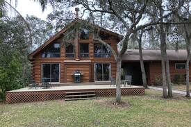 Orange City Cabin | Unique "Log Cabin on a Lake" in the Woods