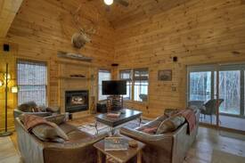 Ellijay Cabin | Clear Creek Cabin is a peaceful and quite 4 bed 2 bath cabin that sits on a mountain stream with pool and ping pong tables.