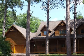 King Villa | Luxury Log Home with private dock on the Chain