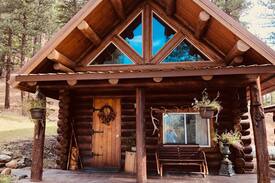 Missoula County House | Log cabin nestled in the mountainsides
