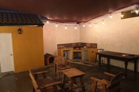 Ulbrich House | Yellow house with backyard for parties