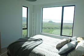 Curio Bay House | The Little Black Barn overlooking Curio Bay