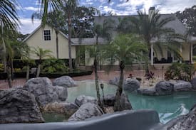 Citrus Park House | Secluded Tropical Estate Waterfall pool & pavilion
