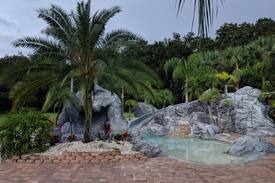 Citrus Park House | Secluded Tropical Estate Waterfall pool & pavilion