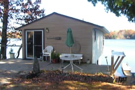 Irons House | COZY WATERFRONT BOATHOUSE BIG BASS LAKE IRONS MI