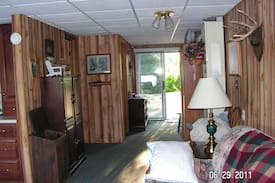 Irons House | COZY WATERFRONT BOATHOUSE BIG BASS LAKE IRONS MI