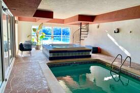 Plattsmouth House | The Cove: Lakeside Beach, Hot Tub, and Indoor Pool