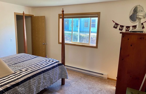 Juneau Apartment | Sunny apartment near a lake, great walking trails, and a playground on site.