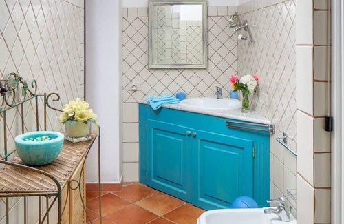 Cala Liberotto Apartment | Cozy apartment, 150 from the beach. Family-friendly, with garden and parking.