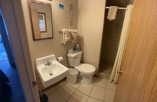 Onalaska House | Overlooking Lake Onalaska -- Two Queen beds + bathroom in nostalgic motel