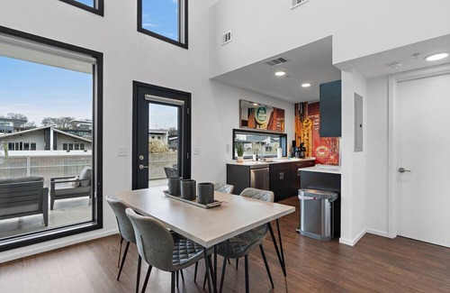 The Gulch Condo | Urban Condominium: Featuring a Pool and Balcony in a Contemporary Mid-Rise