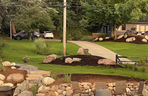 Rapid City House | 50 feet of Torch Lake frontage! Boathouse, beautiful patios sweet little beach.