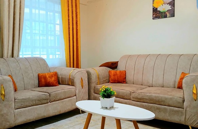 Cosy Homes Eldoret. Queen bed overlooking downtown.