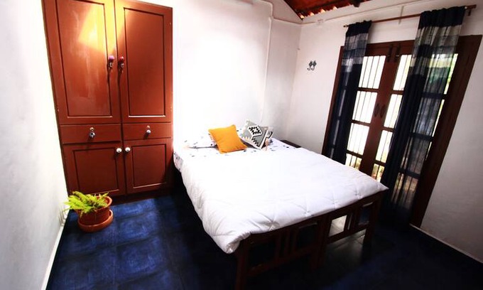 Palayam House | Idam- cosy double bedroom with a great breakfast
