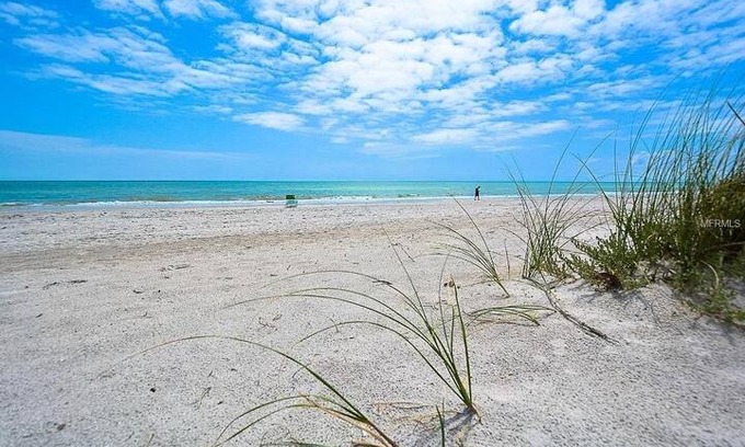 Madeira Beach House | Cozy vintage beach cottage steps to the sand