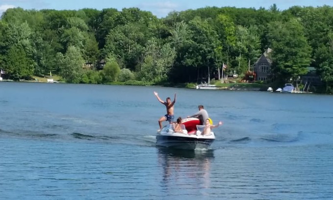 Irons House | COZY WATERFRONT BOATHOUSE BIG BASS LAKE IRONS MI