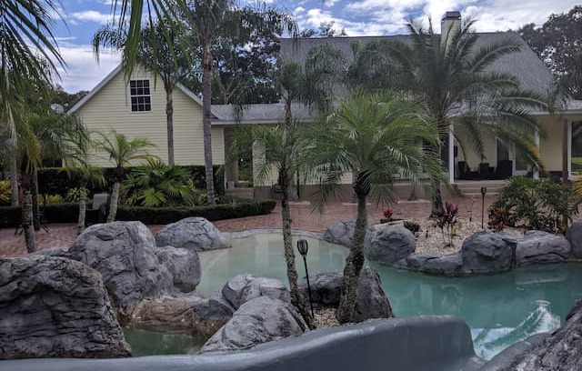Citrus Park House | Secluded Tropical Estate Waterfall pool & pavilion
