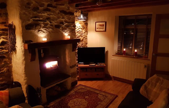 Newborough Cabin | Tan Y Fron Cottage Newborough beach with cosy fire