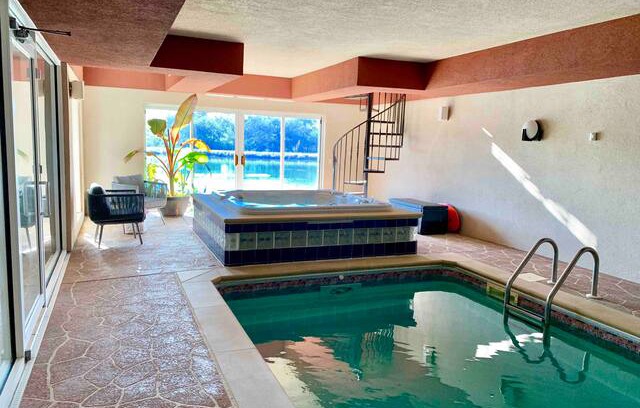 Plattsmouth House | The Cove: Lakeside Beach, Hot Tub, and Indoor Pool