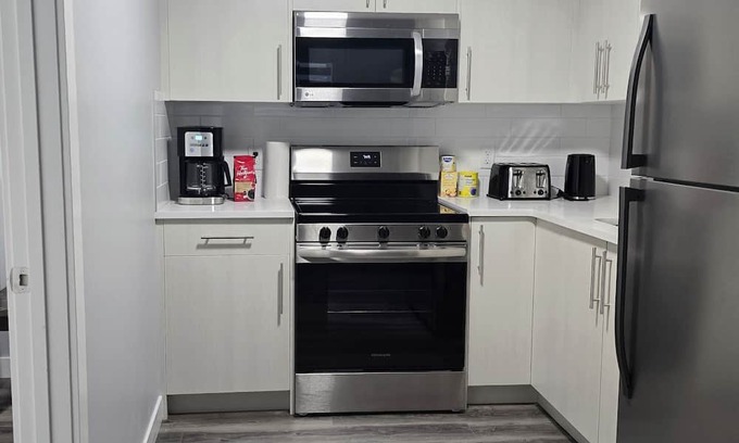 Panorama Hills House | Fully furnished walkout basement suite 1 bedroom, living and bath