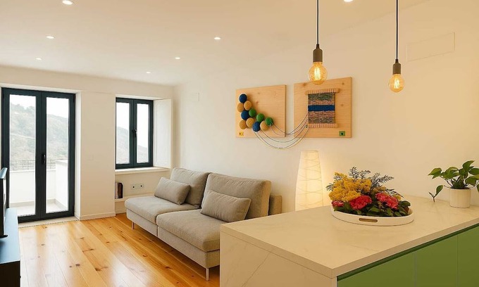 Covilha Apartment | Apartment in the former working-class neighborhood linked to the wool industry. The bright living room and decor featuring burel pieces evoke the city's history. A fully equipped kitchen, two comfortable bedrooms, and ensure an autentic stay.